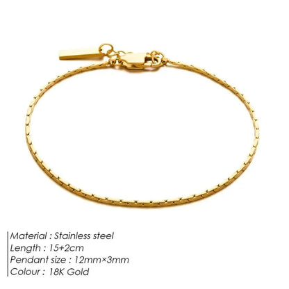 Gold wire chain bracelet laid flat on a white background, labeled Stainless steel, 15+2cm length, 12mm×3mm pendant size, 18K Gold colour.