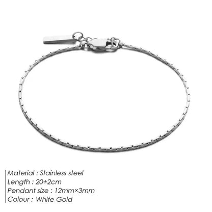 White gold-tone wire chain bracelet laid flat on a white background, labeled Stainless steel, 20+2cm length, 12mm×3mm pendant size, White Gold colour.