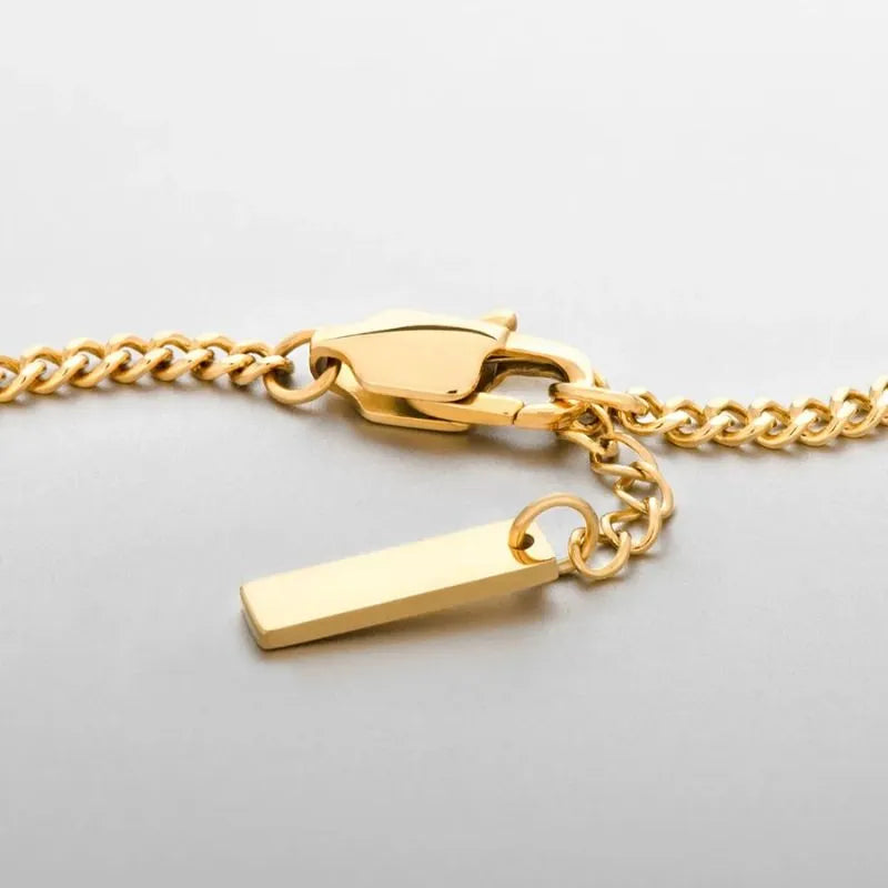 Essential Cuban Chain Bracelet showcasing a minimalist gold stainless steel chain for everyday wear.