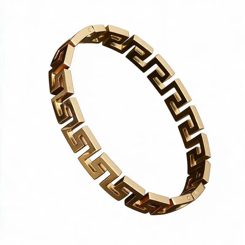 Gold Greek key link bangle bracelet, on a plain white background.