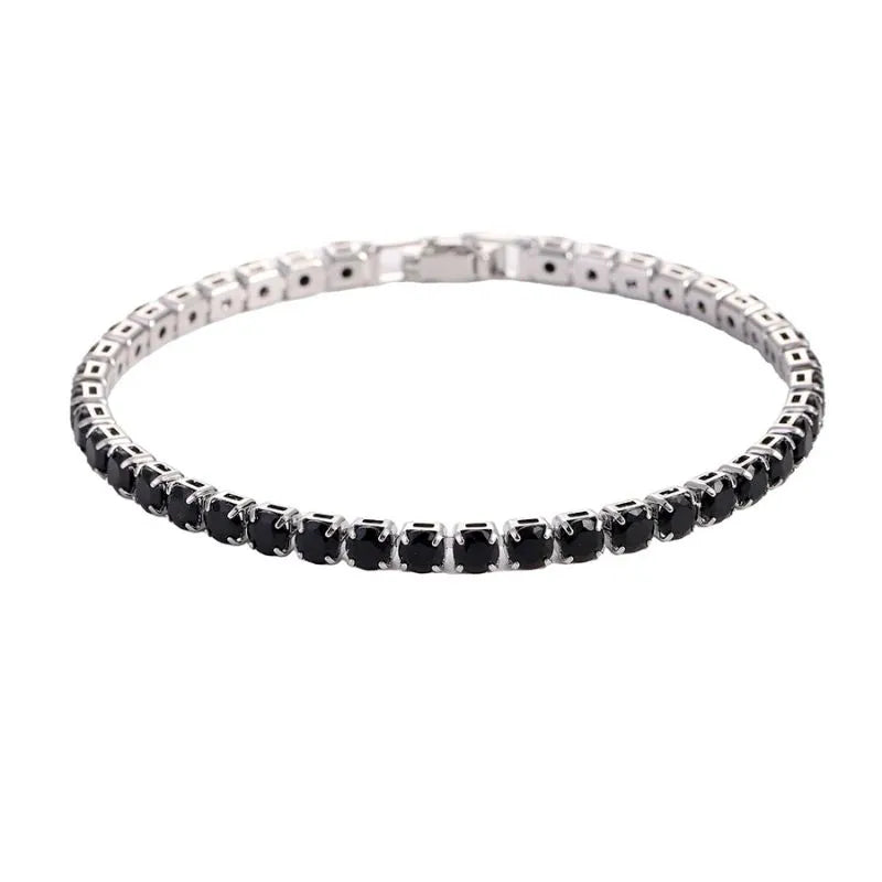 Tennis bracelet with black onyx-coloured stones in a silver setting, on a plain white background
