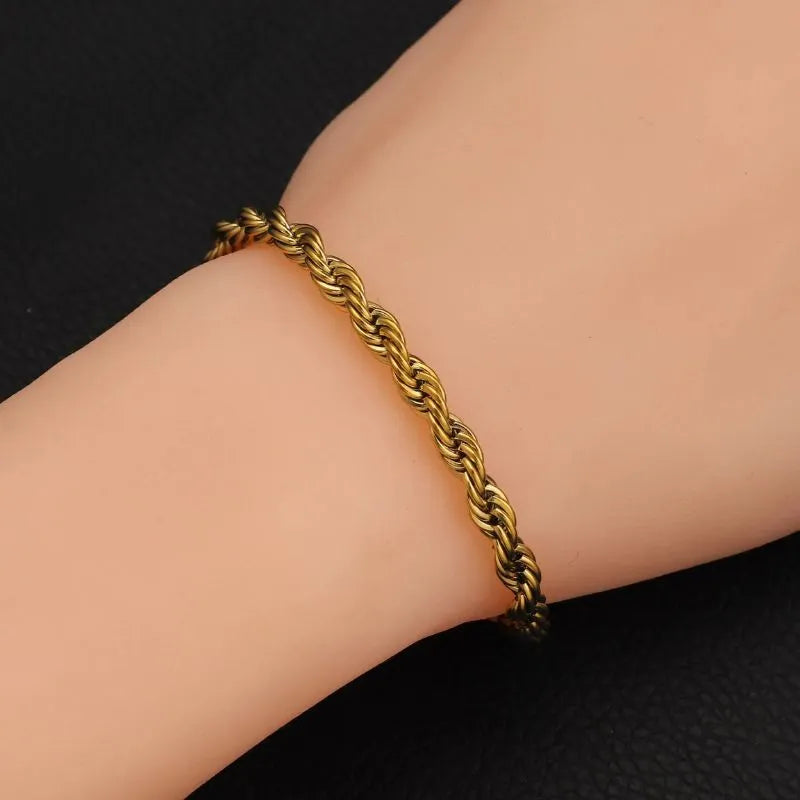 Gold Singapore rope bracelet with twisted chain links and a secure lobster-claw clasp.