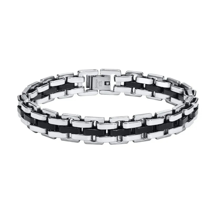 Two-tone silver and black watchband-link bracelet laid in an oval on a plain white background.