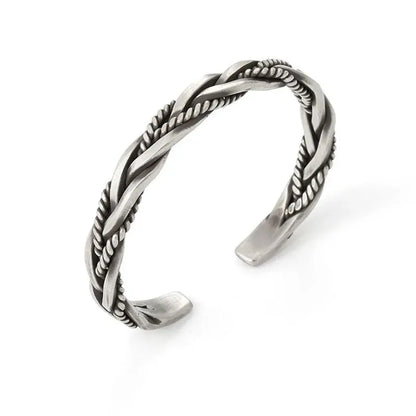 Silver open-cuff twisted bracelet shown from another angle on a plain white background.