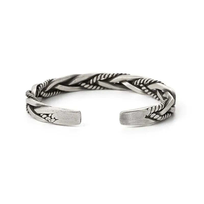 Vintage-inspired sterling silver cuff bracelet with an intricate twisted pattern and comfortable open-ended design.