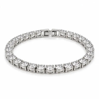 Silver tennis bracelet with round cubic zirconia stones, on a plain white background.