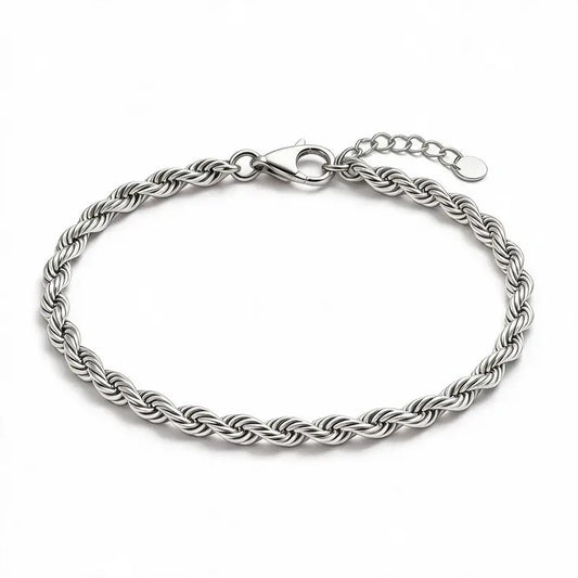 Silver twisted rope chain bracelet with a lobster clasp, round tag charm, and an adjustable extension chain, on a plain white background