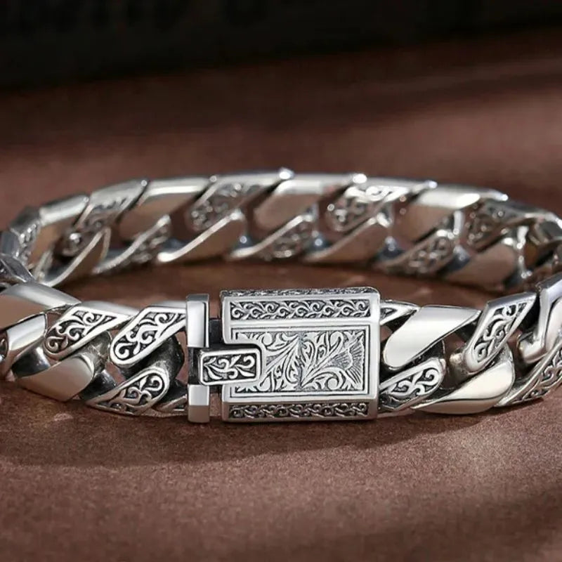 Bold engraved sterling silver bracelet designed for casual, biker, punk, and statement fashion.