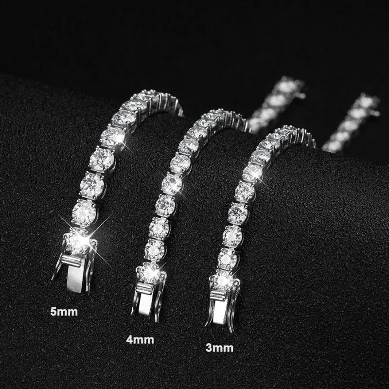 Three tennis bracelets in 3mm, 4mm, and 5mm stone widths, laid diagonally on a black textured surface, labeled 'Real Moissanite, 3/4/5mm D color diamond, Pass diamond tester.'