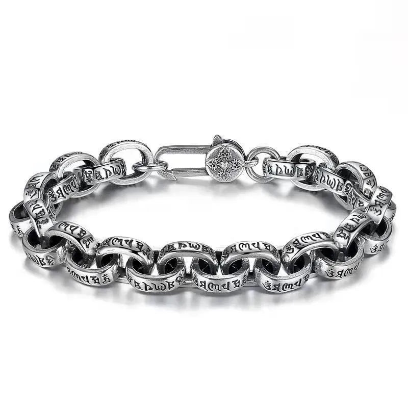 Silver oval-link chain bracelet with engraved Tibetan mantra script, laid in an oval on a plain white background.