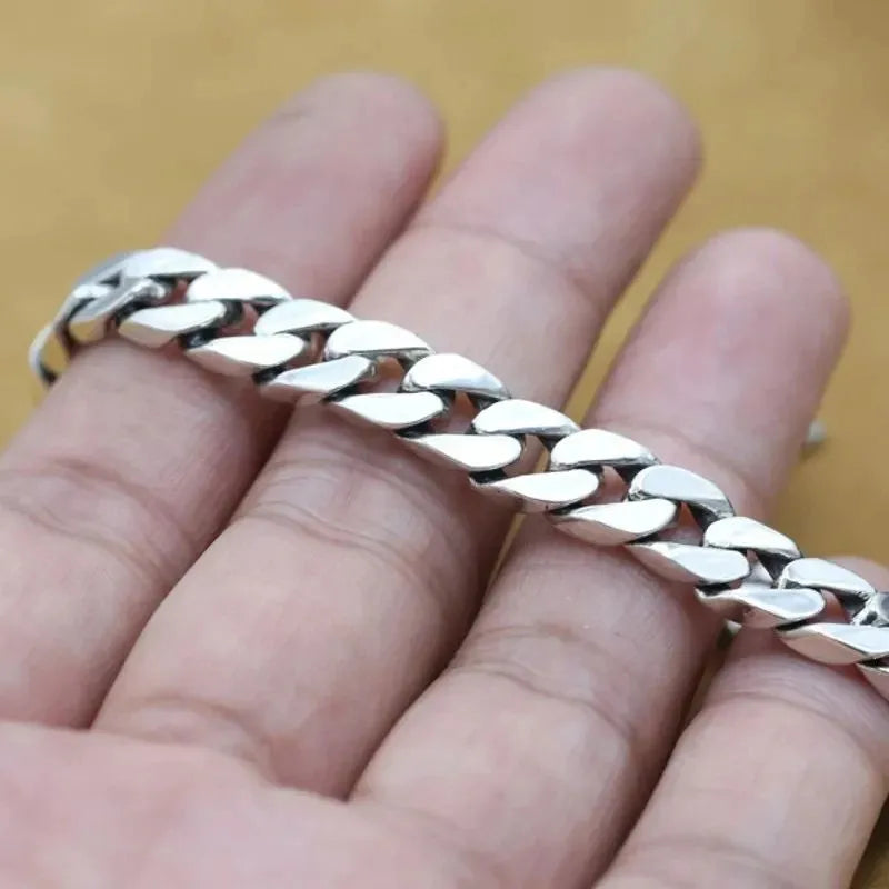 Close-up of the Men's Bracelet Silver featuring polished Cuban links and premium sterling silver.