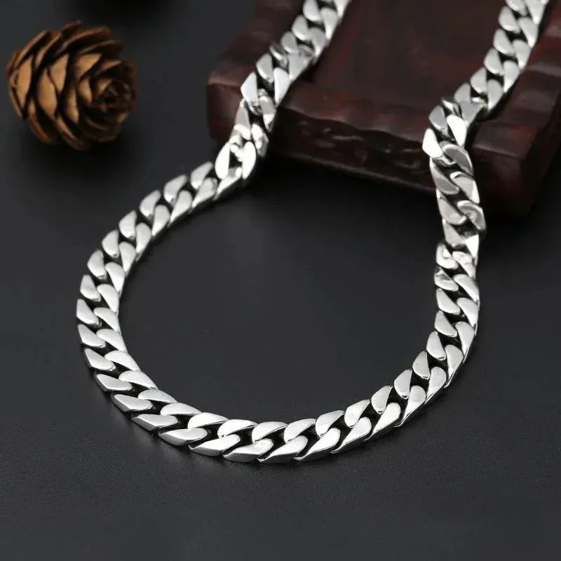Solid silver Cuban bracelet for men with a timeless polished link construction.