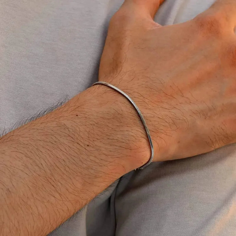 Layered men's stainless steel bracelets with twisted, flat, and classic chain designs for everyday style.