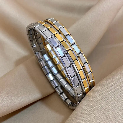 Stainless steel Italian link elastic bracelets in silver, gold, and two-tone finishes