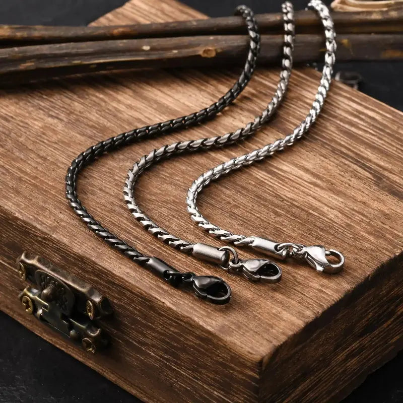 Black, antique, and silver stainless steel slim snake link bracelets