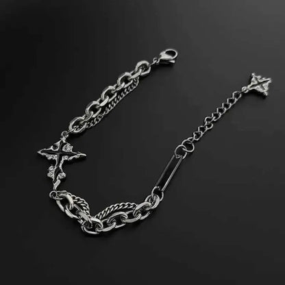 Dark cross bracelet flat lay with adjustable extension chain