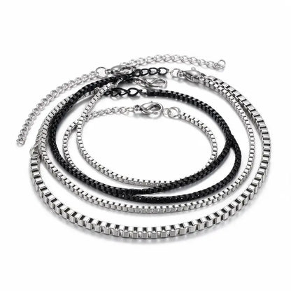 Set of 4 stainless steel box chain bracelets, 3 silver and 1 black, product photo on white background