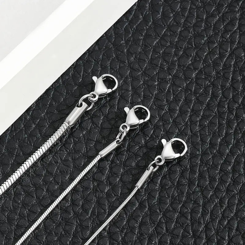 Close-up of silver snake chain bracelet lobster clasps